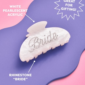 K&ouml;nnte beinhalten: Wei&szlig;er, perlmuttartiger Haarklaue aus Acryl mit einem Strass-Design "Bride".
