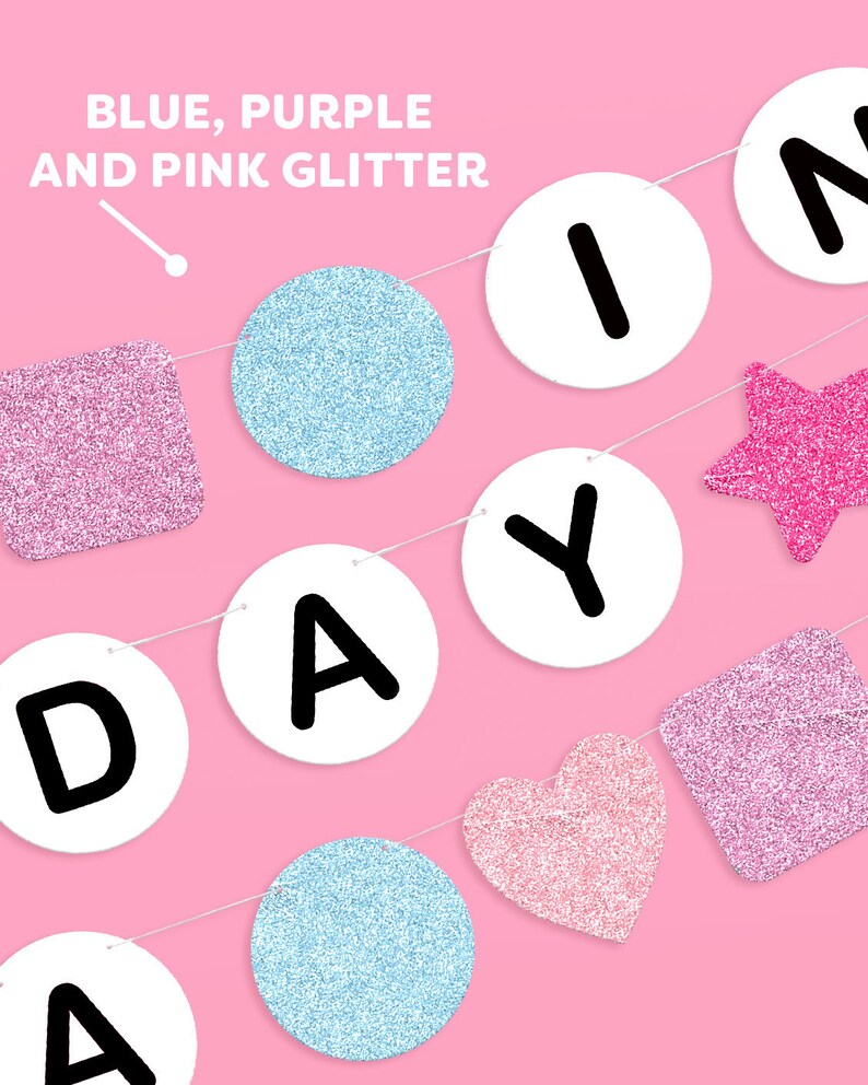 May include: A pink and blue glitter birthday banner with the word "Birthday" spelled out in white circles with black letters. The banner also includes a pink star, a pink heart, and two blue glitter circles.
