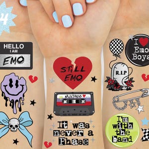 May include: A collection of temporary tattoos with an emo theme. Designs include a broken heart, a cassette tape, a smiley face, a skull bow, and the phrases "HELLO I AM EMO", "STILL EMO", and "It was never a Phase".