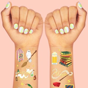 May include: Temporary tattoos featuring wizarding-themed designs. The designs include a candy cart, an owl on a broom, potion bottles, a snake, a crystal ball, a stack of books, a beer mug, a magic wand, a frog, and a shield. The background is a light pink.