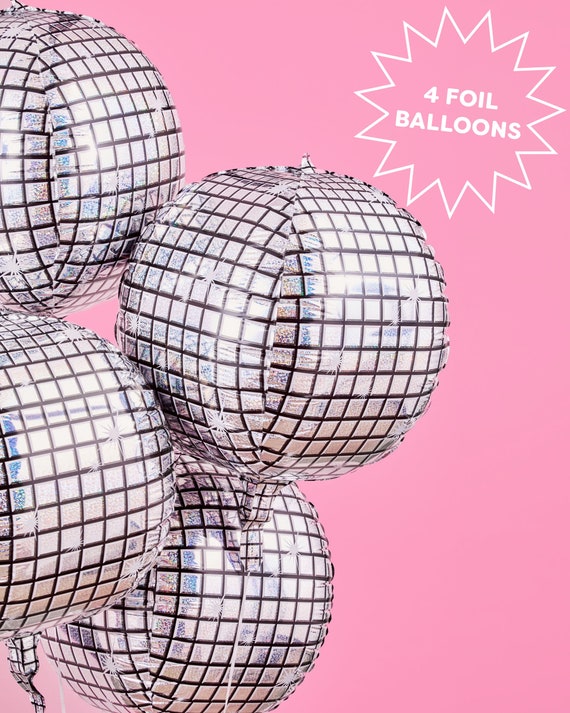 Premium Photo  Disco balls for decorationof a party on pink background