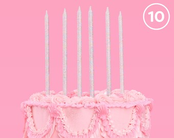 May include: Pink frosted cake with 6 silver glitter candles and the number 10 in a white circle on a pink background.