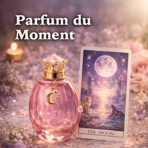 May include: A pink perfume bottle with a gold crown-shaped cap and a crescent moon charm. The bottle is next to a tarot card depicting a full moon and two wolves. The text "Parfum du Moment" is at the top.