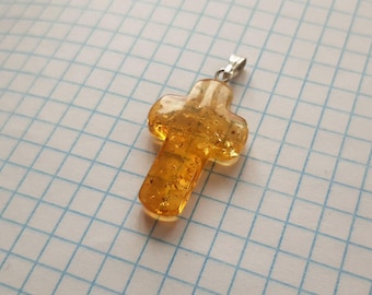 Orthodox Catholic cross made of molten amber