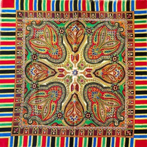 May include: Square scarf with a central paisley design in red, green, yellow, and blue. The scarf has a white background and a border with vertical stripes in red, black, green, and blue. The scarf is likely made of silk or a similar fabric.