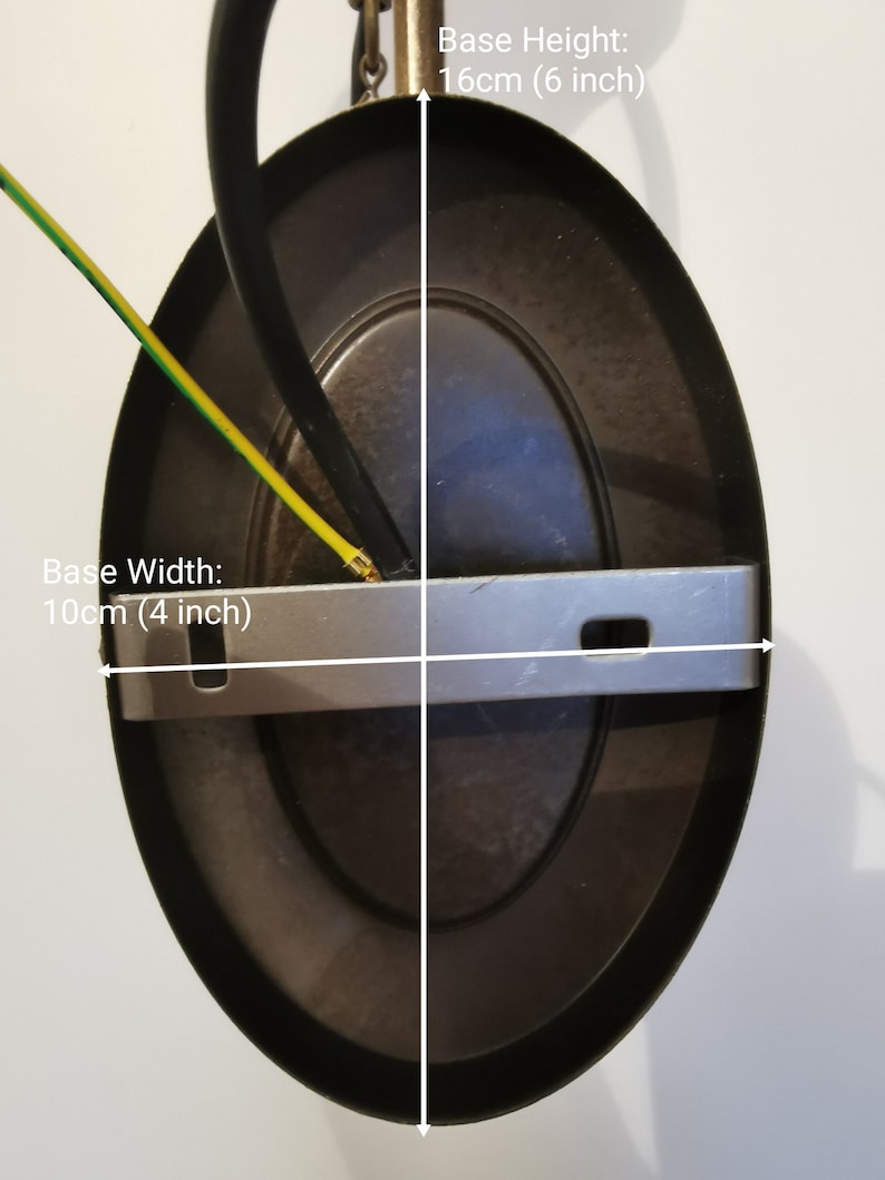 May include: A dark brown oval-shaped ceiling light fixture. The base width is 4 inches, and the base height is 6 inches. The fixture has a metal bracket and a black wire. The text "Base Width: 10cm (4 inch)" and "Base Height: 16cm (6 inch)" are visible.