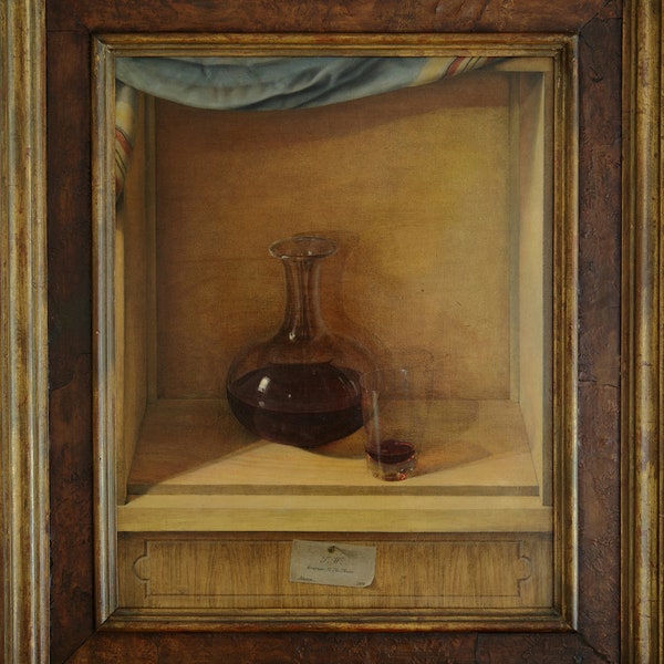 Trompé l'œil oil on board of red wine decanter and glass set in wooden nook with pinned business card to base in James Bourlet & Sons frame