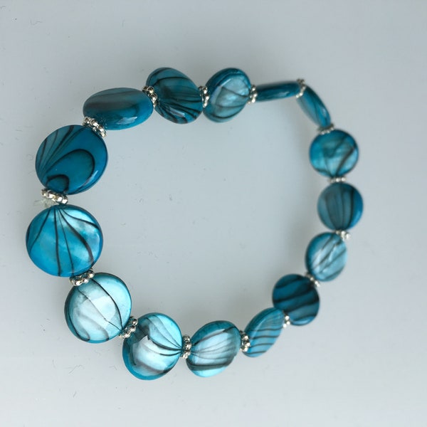 Bracelet made of acrylic beads in blue black striped