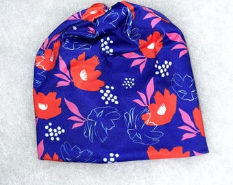 POPPIES ON BLUE Fun design in Alpine or Nordic style Hat in 4 way sport stretch, fleece ear band, and Pompom