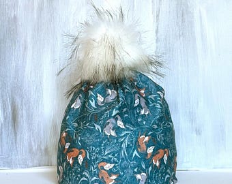 DANCING FOXES  Alpine or Nordic in active stretch with micro-fleece ear band . Alpine and Faux Fur Pompom.
