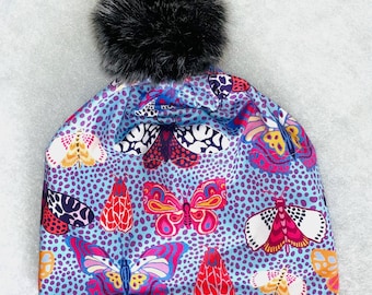 COLORFUL MOTHS in PERIWINKLE - Alpine or Nordic style Hat in 4 way sport stretch, fleece ear band, and a Pompom