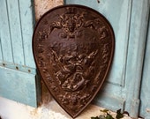An 18th Century French hand cast iron plaque - coat of arms depicting horses, cherubs and angels - chateau wall sign