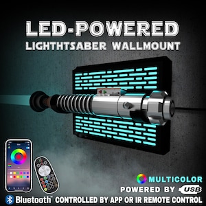 May include: A silver and black lightsaber wall mount with a blue light beam. The mount is black with blue LED lights. The text on the image reads "LED-POWERED LIGHTSABER WALLMOUNT". It is Bluetooth controlled by app or IR remote control.