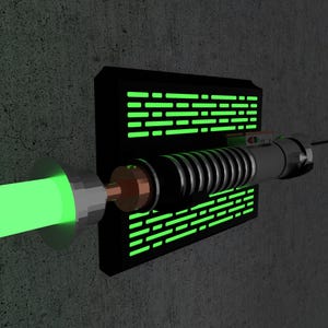 May include: A green lightsaber with a silver and black handle, emitting a bright green beam. The lightsaber is mounted on a black rectangular wall fixture with glowing green accents, set against a textured gray wall.