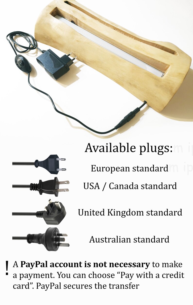 May include: A wooden base with a light source inside. The base is connected to a power adapter with a cord and a plug. The image shows four different types of plugs: European standard, USA/Canada standard, United Kingdom standard, and Australian standard. The text on the image reads: "Available plugs: European standard, USA/Canada standard, United Kingdom standard, Australian standard. A PayPal account is not necessary to make a payment. You can choose "Pay with a credit card". PayPal secures the transfer."