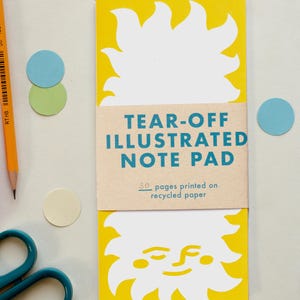 Bloc de notas ilustrado con hojas desprendibles y diseño de puesta de sol baja