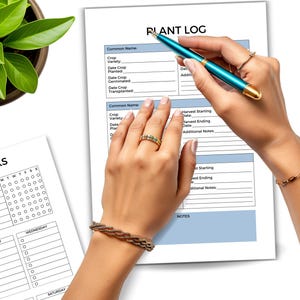 May include: A close-up of a plant log and garden tasks planner. The plant log has fields for common name, crop variety, and dates. A teal pen is held over the log. A potted plant is in the upper left corner.