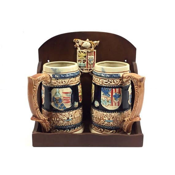 Beer Stein Set In Wood Wall Shelf With Meval Coat Of Arms Image 0