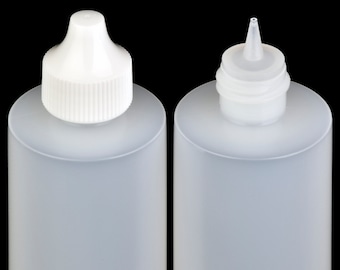 May include: Two clear plastic bottles with white squeeze tops. The bottles are empty and have a cylindrical shape.