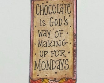 Imán de nevera con la frase "El chocolate es el camino de Dios", dibujado a mano.