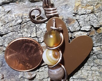 Brass heart pendant with agate beads wrapped in antiqued colored wire