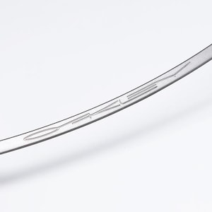 May include: A close-up of the silver metal arm of a pair of sunglasses with the word "Oakley" engraved on it.