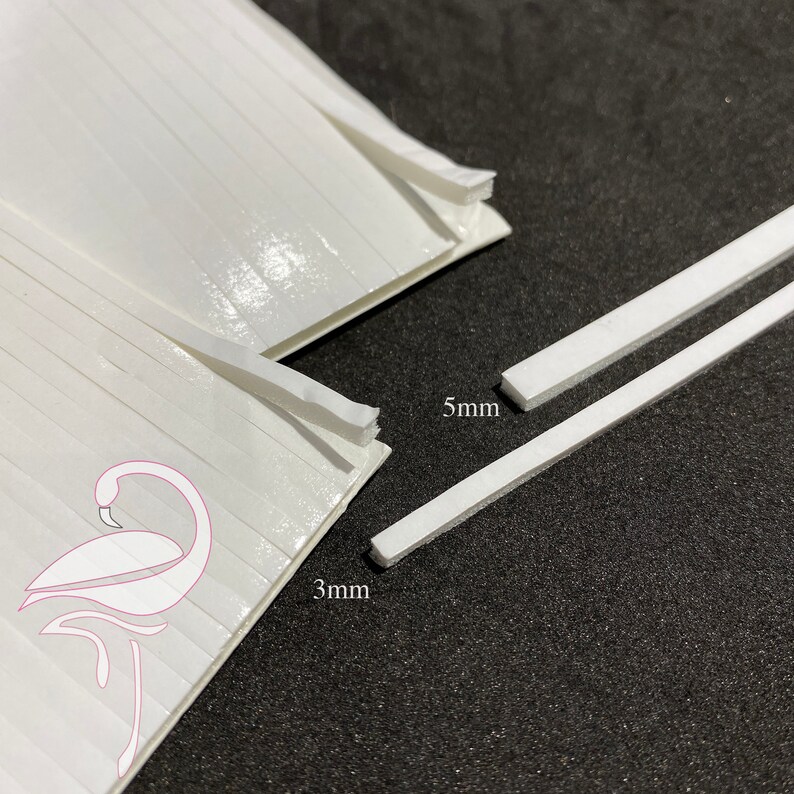 May include: Two white adhesive strips, one 3 mm wide and the other 5 mm wide. The strips are shown on a black surface.