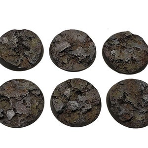 May include: Ten textured, round bases for miniature figures. The bases are primarily brown with gray and tan accents, giving a weathered, rocky appearance. Ideal for tabletop gaming or model building.