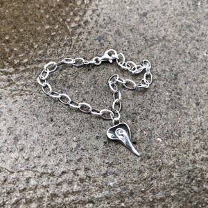 What Lies Beneath - Sterling Silver Charm Bracelet.