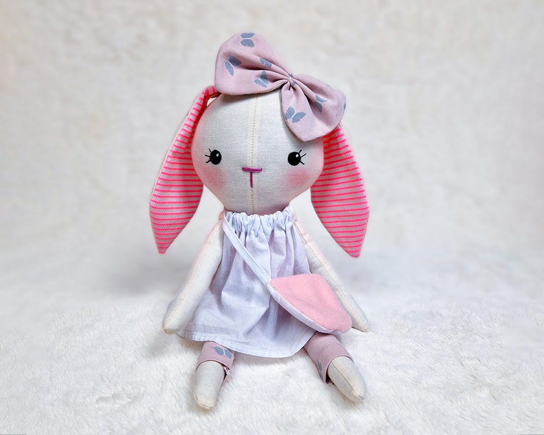 Unleash your creativity and make your own charming bunny rabbit doll with our easy-to-follow PDF sewing pattern and tutorial. This soft toy pattern comes with all the necessary instructions and templates to make a cute doll Bunny