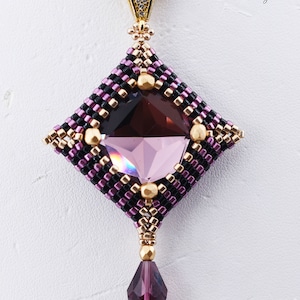 May include: A square-shaped pendant with a large amethyst gemstone in the center. The pendant is made with black, gold, and pink beads and has a small amethyst teardrop hanging from the bottom. The pendant is attached to a gold chain. The text "Catalina Pendant (c) 2023 Amethyst/champagne" is below the pendant.