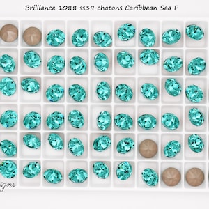 May include: A tray of chatons in Caribbean Sea color, with a mix of round and oval shapes. The tray also contains several round, light brown chatons. The text "Brilliance 1088 ss39 chatons Caribbean Sea F" is at the top.