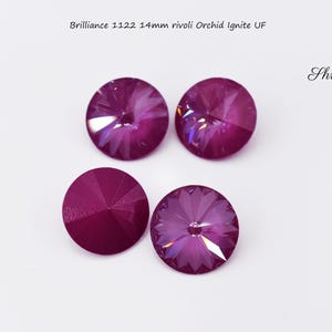 May include: Four purple 14mm rivoli crystals with a faceted design. Brilliance 1122 Orchid Ignite UF.