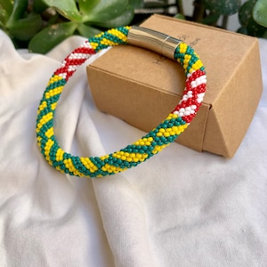 Idde de Orula con dettales Shango