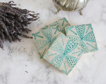 four hand painted moroccan tile coasters with gold leaf sides