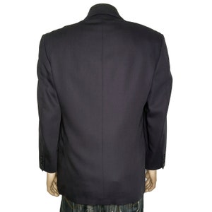 May include: A dark blue blazer with a single-breasted closure and long sleeves.