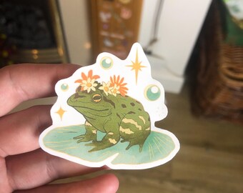 Whimsical Pond Toad On Lillypad Matte Vinyl Sticker | Magical Flower And Stars Frog Decal