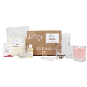 May include: Candle making kit with a brown box, clear glass jars, white wax flakes, red dye, wicks, and a bottle of fragrance oil. The box has the text "Cosy Owl" and "Penny Pinch's Candle Making Kit".