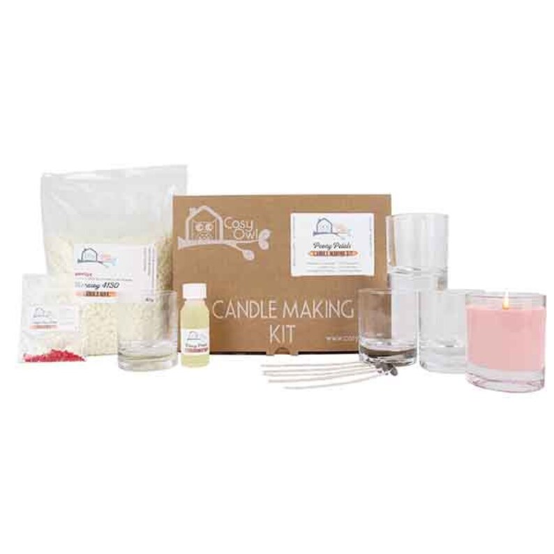 May include: Candle making kit with a brown box, clear glass jars, white wax flakes, red dye, wicks, and a bottle of fragrance oil. The box has the text "Cosy Owl" and "Penny Pinch's Candle Making Kit".