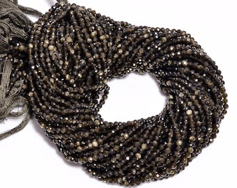 May include: A strand of dark brown faceted gemstone beads. The beads are small and have a shiny, metallic finish.