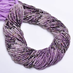 May include: A strand of purple amethyst beads, approximately 4mm in size, with a faceted finish. The beads are strung on a thread and are ready to be used for jewelry making.