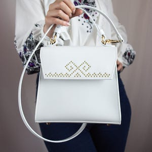 Exclusive white handmade etno leather bag with metal inlay. Hand stitch. Hand made