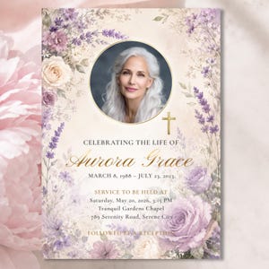 May include: A funeral program card featuring a circular portrait of a person with long white hair, surrounded by watercolor lavender and cream roses. The text reads: CELEBRATING THE LIFE OF Aurora Grace, MARCH 8, 1988 – JULY 23, 2023, and service details.
