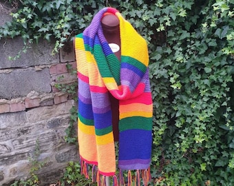Hand made extra long 12 foot rainbow scarf. Hand knit in bright colours. Wrap yourself in a rainbow. Machine washable.