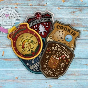 May include: Embroidered patches with Christmas themes, including "North Pole Christmas Cheer" with a meter, "Peppermint Park", "Cookie", and "Cocoa Commission" designs. The patches are in various shapes and colors.