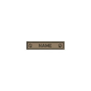 May include: A brown leather dog tag with a paw print on each end and the word "NAME" in the center.