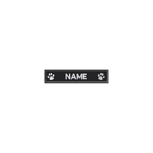 May include: Black rectangular dog tag with white paw prints on either side and the word "NAME" in white text.