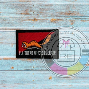 May include: A black and red embroidered patch with a cartoon weasel and the text "I'll tread where I please".