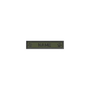 May include: A green rectangular dog tag with black paw prints on either side and the word "NAME" in the center.