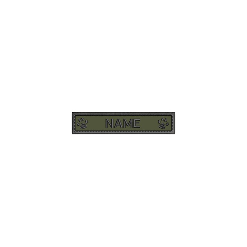 May include: A green rectangular dog tag with black paw prints on either side and the word "NAME" in the center.